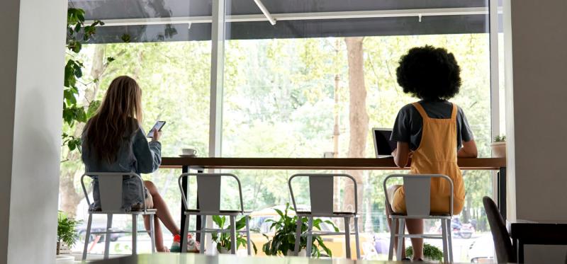 event attendees sitting six feet apart at a meal